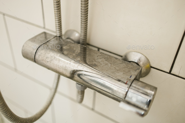 kabel musicus Minder dan Close-up of shower mixer faucet with limescale, white chalky deposit and  stains. Formed on the Stock Photo by Satura_