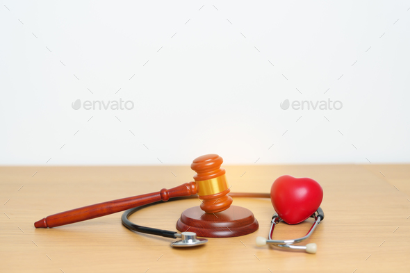 Gavel and stethoscope on table. Medical and Health Law, legal of medical malpractice concept