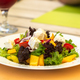 Greek salad on a white plate in a summer cafe - PhotoDune Item for Sale