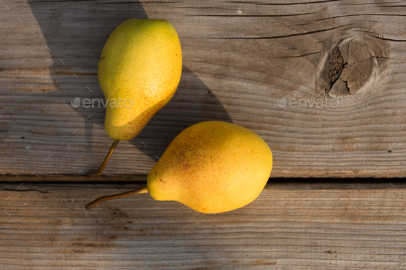 Yellow pears on a wooden background close-up - Stock Photo - Images
