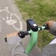 Close up of push scooter ridden by unrecognizable person on bicycle lane - PhotoDune Item for Sale