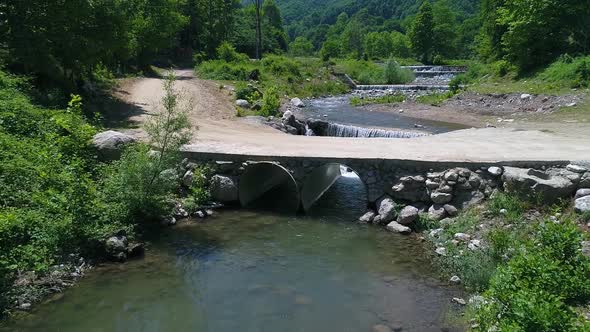Weirs on the stream. Artificial waterfall flow of water.