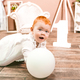 Little redhead baby girl wih balloon celebrates first birthday anniversary. 1 year family party  - PhotoDune Item for Sale