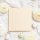 Square Blank card near cream roses and white silk ribbons top view, wedding mockup - PhotoDune Item for Sale