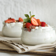 Greek yogurt, nuts and strawberries in a glass jars on a white table close up, copy space - PhotoDune Item for Sale