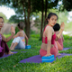Group of young women exercising outdoors with Zen yoga. - PhotoDune Item for Sale
