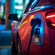Close-up view of an electric car with charger plug on it - PhotoDune Item for Sale