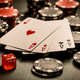 Poker cards and chips on black background, gambling casino table - PhotoDune Item for Sale
