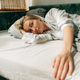 Beautiful blonde woman in pajamas on the bed in the morning after waking up. - PhotoDune Item for Sale