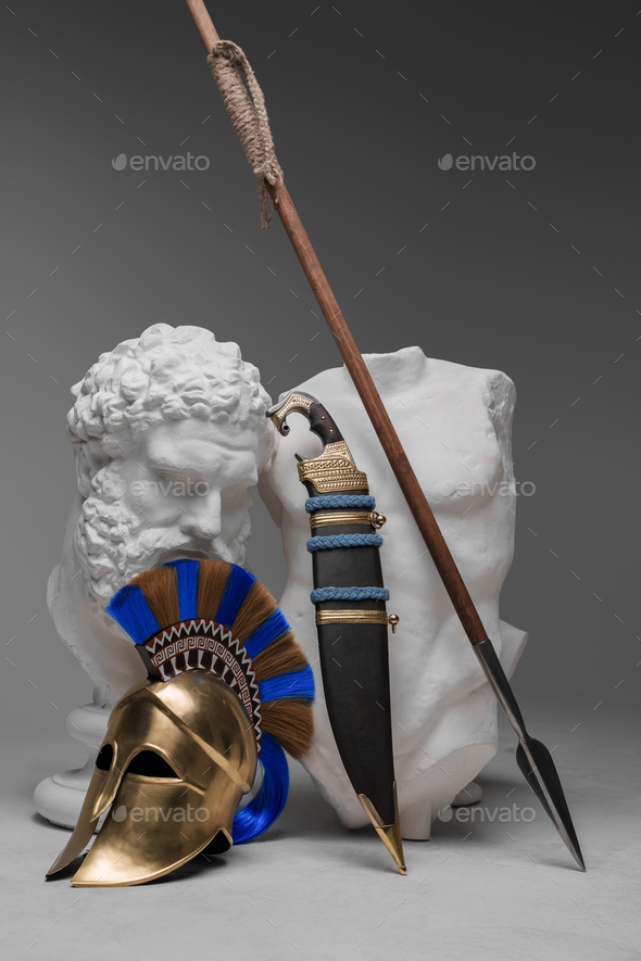 Weapons of greek soldier and marble bust with body - Stock Photo - Images
