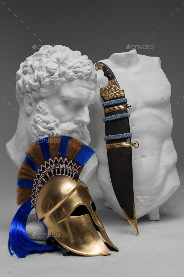 Greek marble sculpture with dagger and plumed helmet - Stock Photo - Images