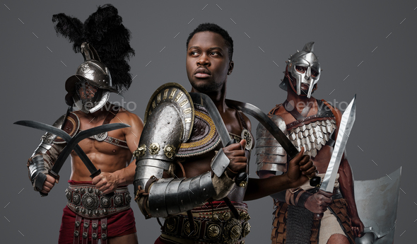 Black gladiator with naked torso with two comrades - Stock Photo - Images
