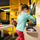 Baby girl playing in kids kitchen at children play center. - PhotoDune Item for Sale