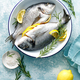 Fresh raw dorado fish cooking with lemon and rosemary. Sea bream, dorado. Seafood, healthy food - PhotoDune Item for Sale