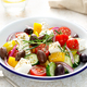 Greek salad. Vegetable salad with feta cheese, tomato, olives, cucumber, red onion and olive oil - PhotoDune Item for Sale