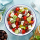 Greek salad. Vegetable salad with feta cheese, tomato, olives, cucumber, red onion and olive oil - PhotoDune Item for Sale