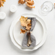 Fall table setting with autumn leaves and white plate on white table. View from above. - PhotoDune Item for Sale