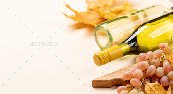 White wine bottles and autumn leaves - Stock Photo - Images