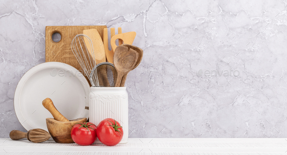 Kitchen utensils on wooden table - Stock Photo - Images