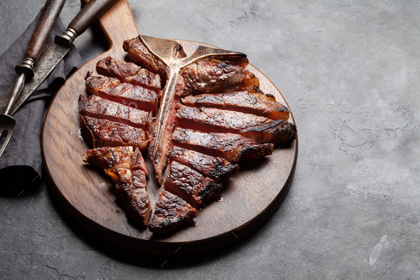 Grilled porterhouse beef steak. Sliced T-bone - Stock Photo - Images