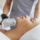 Portrait of relaxed young female client getting SMAS ultrasound face lifting massage - PhotoDune Item for Sale