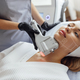 Portrait of relaxed young female client getting SMAS ultrasound face lifting massage - PhotoDune Item for Sale