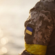 the Ukrainian flag in the form of a chevron on the hand of a military man - PhotoDune Item for Sale