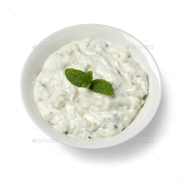 Bowl with traditional Greek tzatziki close up on white background - Stock Photo - Images