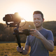 Portrait of happy videographer with camera and gimbal - PhotoDune Item for Sale