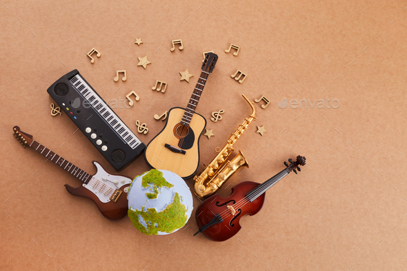 Happy world music day. Musical instruments with globe background.