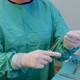 Surgeon, wearing medical protective gloves skillfully maneuvered sterile forceps needle holder - PhotoDune Item for Sale