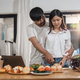 Happy couple cooking together and healthy eating concept - couple cooking food at home kitchen - PhotoDune Item for Sale