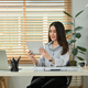Portrait of beautiful asian woman using digital tablet at working desk in home office. - PhotoDune Item for Sale