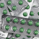 Full frame green round pills in blister pack. Prescription medicine. Top view of green tablet pills. - PhotoDune Item for Sale