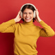 Excited woman listening to music - PhotoDune Item for Sale