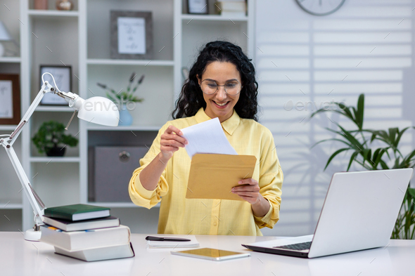 Successful and happy hispanic businesswoman working remotely at home, woman received good news - Stock Photo - Images