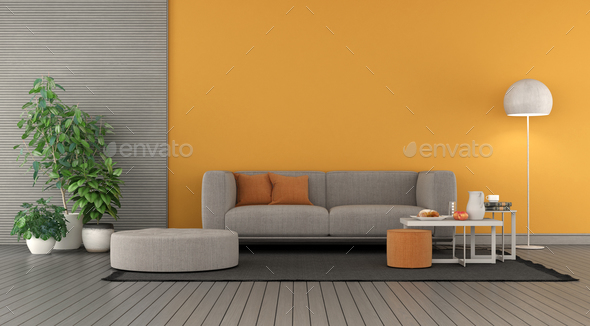 Modern living room with orange wall and gray sofa - Stock Photo - Images