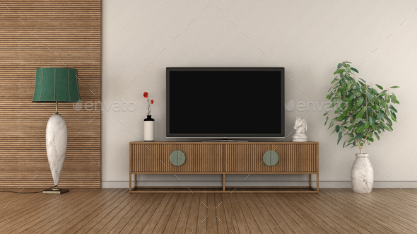 Modern TV on vintage sideboard in a white and wooden room - Stock Photo - Images
