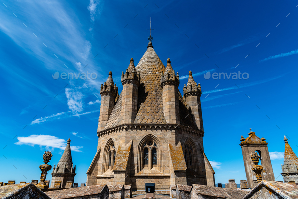 Lantern tower of the Cathedral of Evora. Low angle view against blue sky - Stock Photo - Images