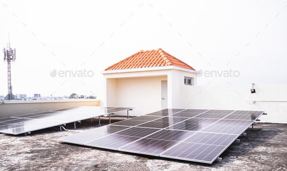 Solar Panels Solar Cells on Rooftop with Sun Overlight Day - Stock Photo - Images