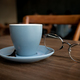 Coffee cup on wooden table with spectacles  - PhotoDune Item for Sale