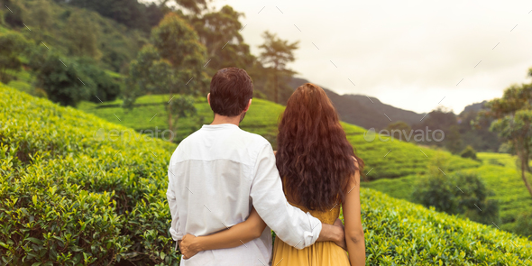 Couple of Travelers in Love in Front of Green Tea Terraces in Sri Lanka Mountains - Stock Photo - Images
