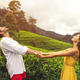 Couple of Travelers in Love in Front of Tea Plantations in Mountains - PhotoDune Item for Sale