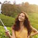 Asian Travel Vlogger Woman with Mobile Phone Camera During Trip to Green Tea Hills in Sri Lanka. - PhotoDune Item for Sale