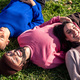 friends resting in a sunny day lying in the lawn - PhotoDune Item for Sale