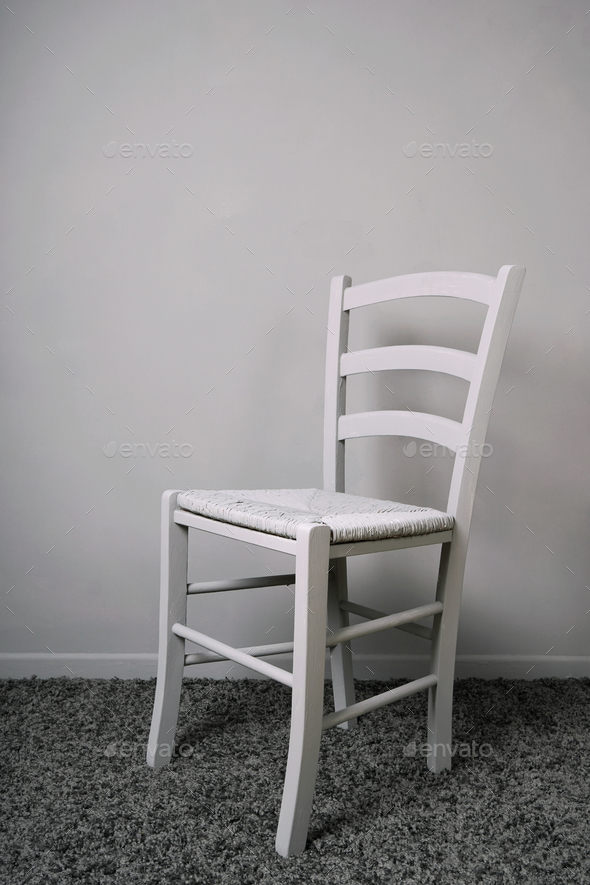 empty vacant chair in gray room