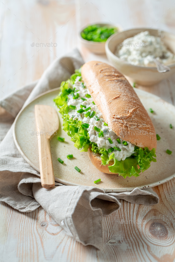Tasty and fresh sandwich with radish and creamy cheese. - Stock Photo - Images