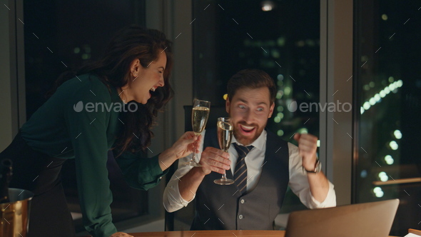 Couple coworkers drinking champagne celebrating business success at office. - Stock Photo - Images