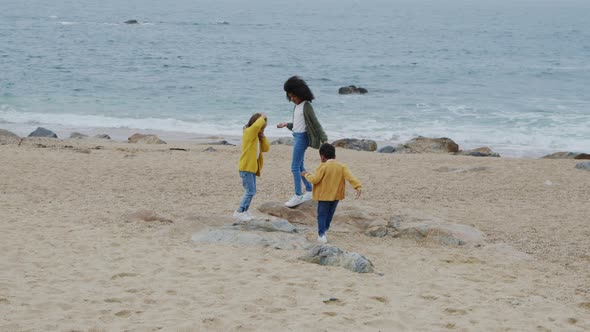 Children Are Playing On Beach