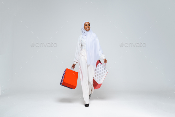 Beautiful arab middle-eastern woman with traditional abaya in studio - Stock Photo - Images